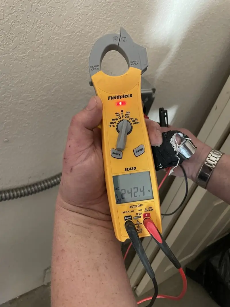 Voltage testing with clamp meter during Outlet Installation in Carefree